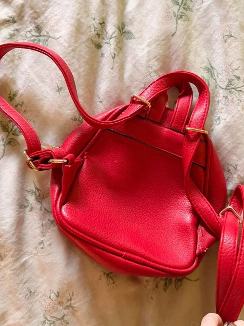 Red mini backpack with gold hardware